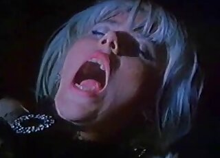 Sexy zoophile lady greedily sucking on a brown horse's huge cock